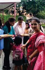 The teachers were warmly greeted at the school gates by parents with a raksha sutra, tikas and a chocolate.