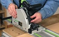easily. 1 2 Fold up the guide rail and position your workpiece against the sliding fence.